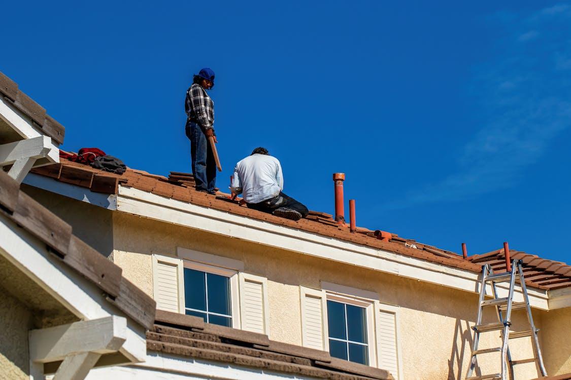 Workers repairing a roof