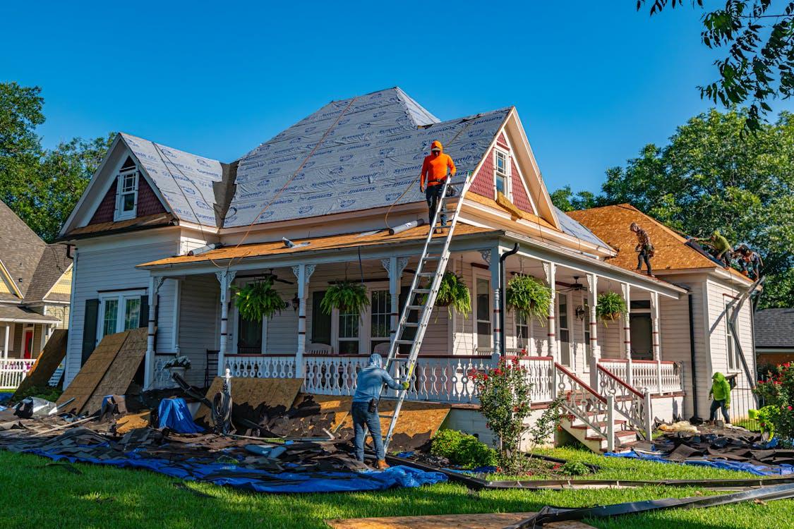 A roofer working on a residential roof