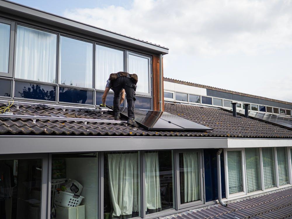 A roofer working on a roof