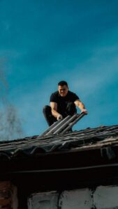 A person repairing a roof
