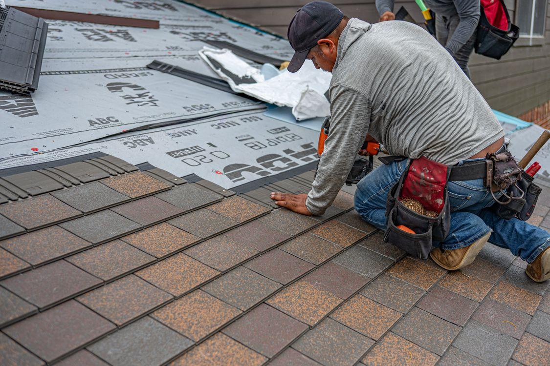 Professional roofers installing a new roof