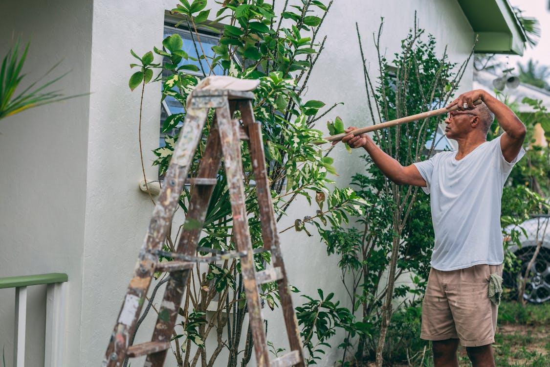 A man painting a home