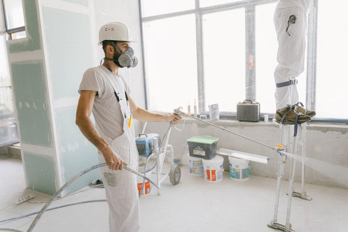 professional painters at work inside a house
